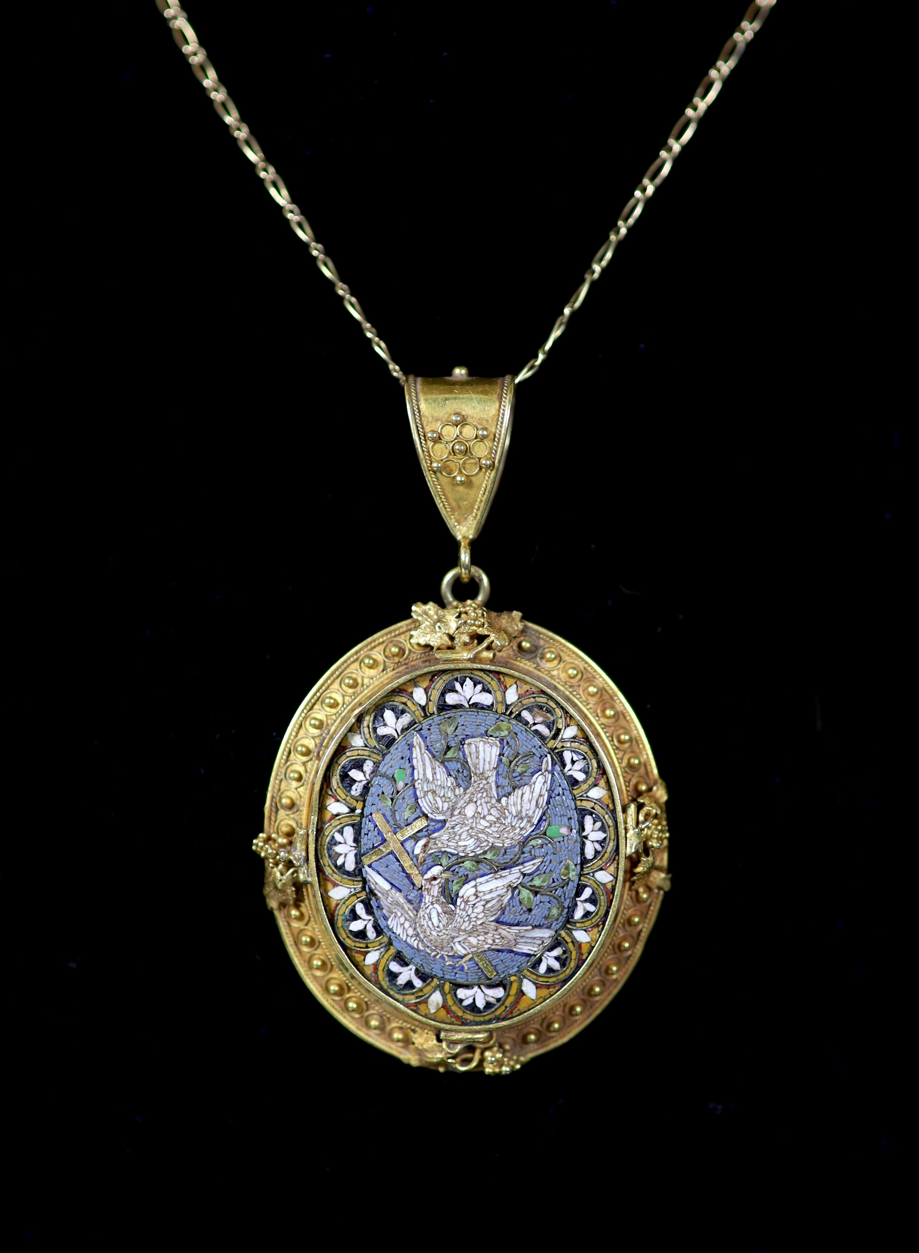 A 19th century gold and micro mosaic set oval pendant, decorated with Doves of Peace